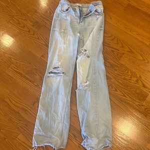 Zara ripped light blue jeans frayed bottoms, wide leg.